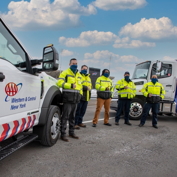 aaa fleet technicians stand in front of buffalo bills stadium