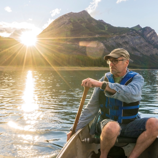 older man kayaking