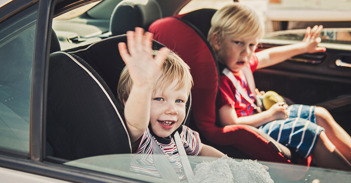 two kids in a car 