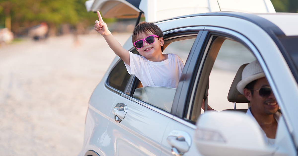 kid enjoying being in car