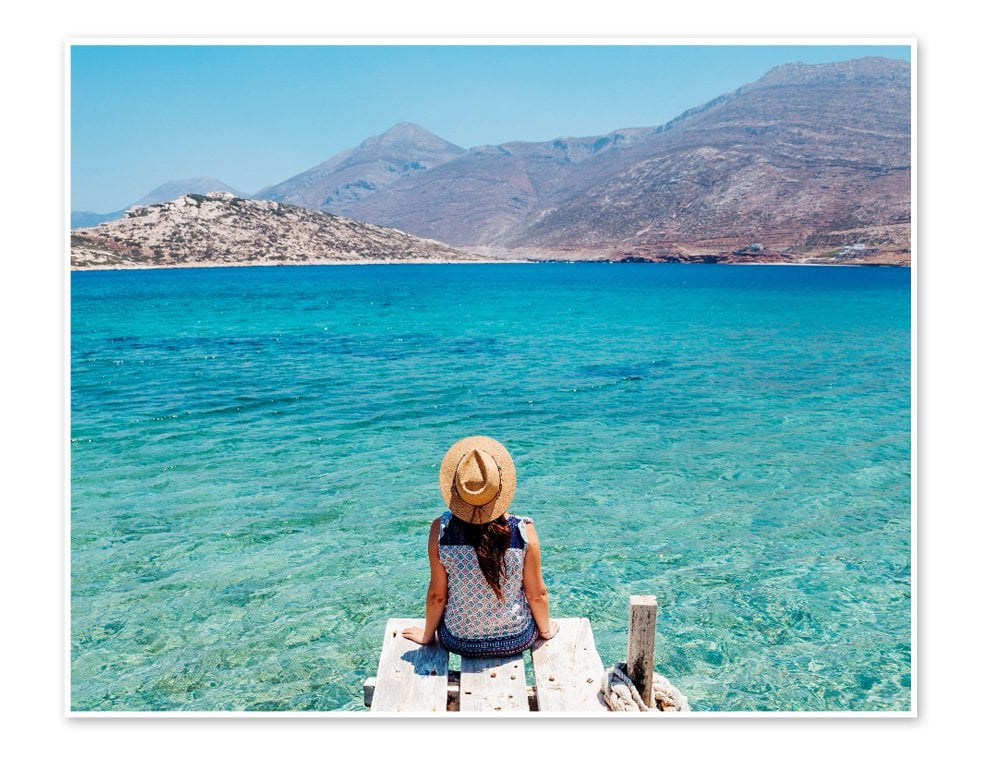 Woman sitting on dock