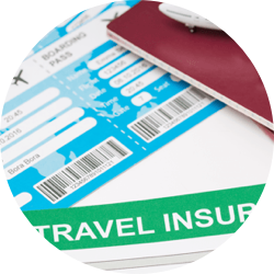 A close up of an airline ticket, passport, and travel insurance form