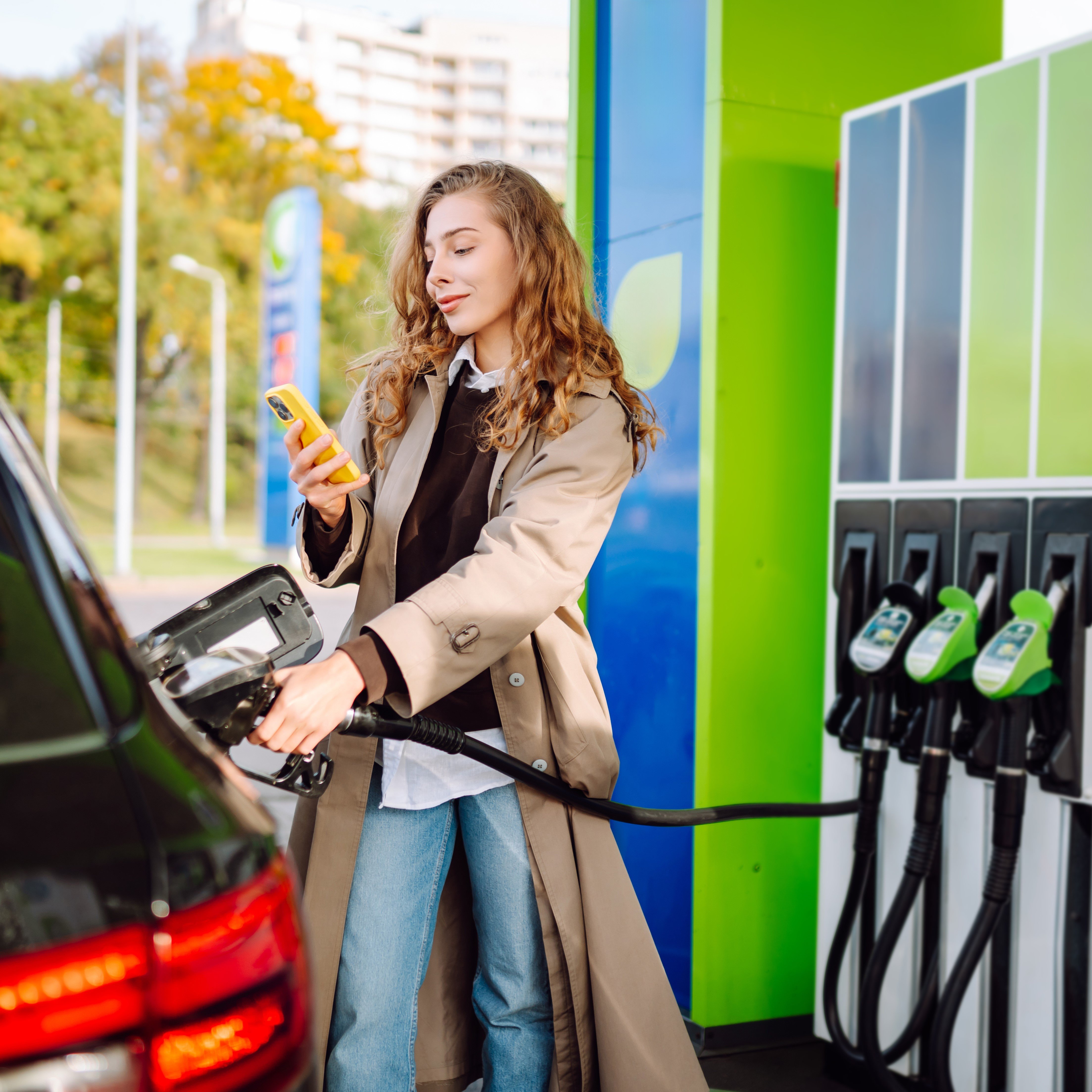 Woman Filling Car with Gasoline