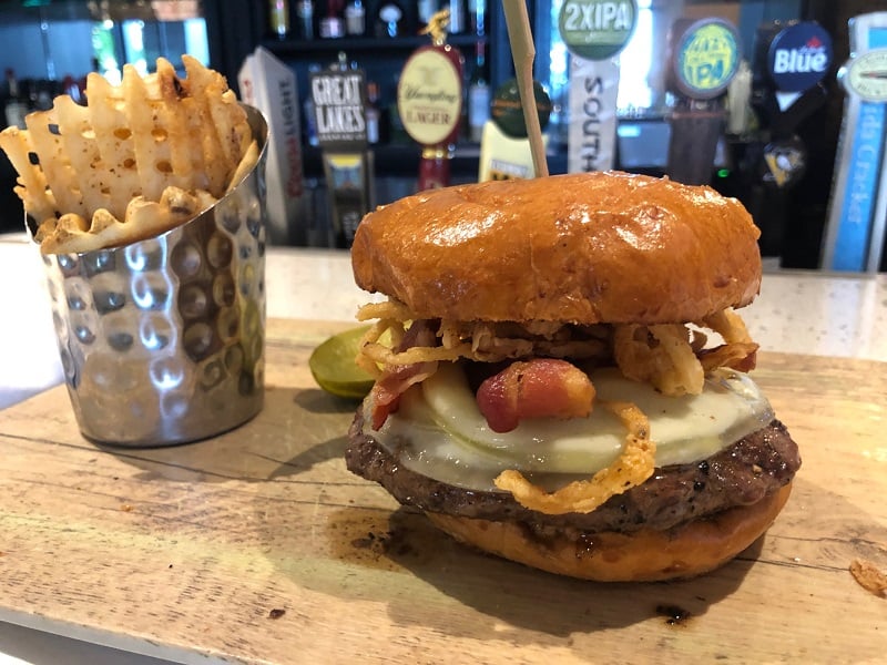 The burgers at Crafted North in Pittsburgh come piled high.