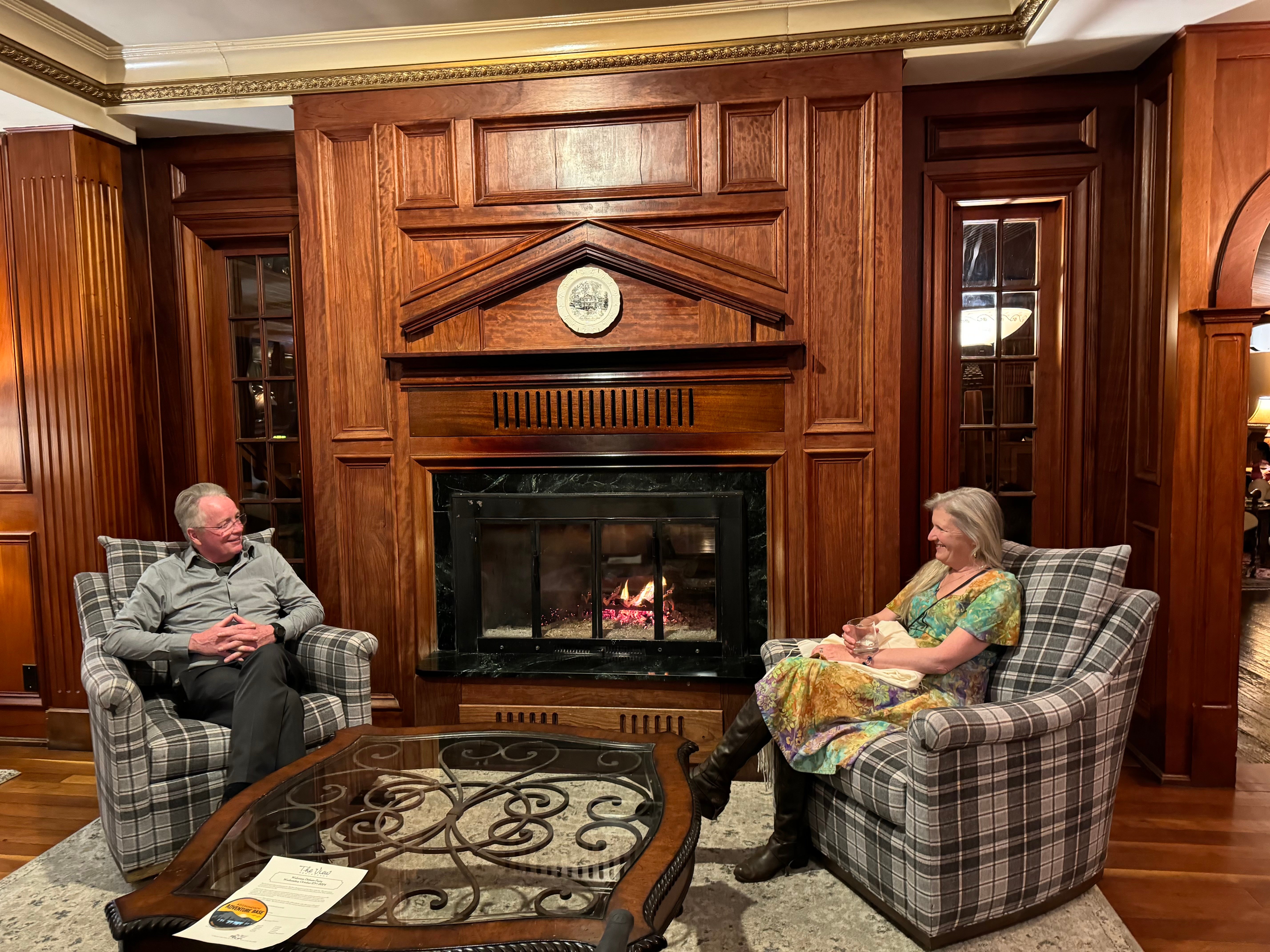 Inn Guests Sitting by a Fireplace