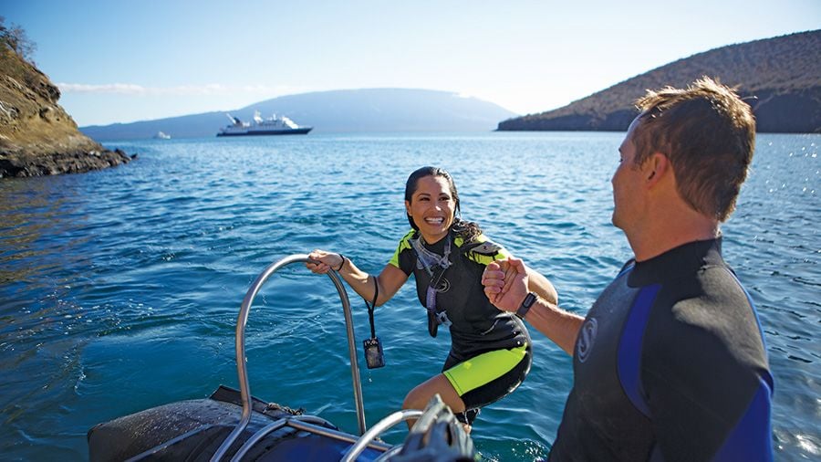 Visitors snorkeling on the Galapagos islands